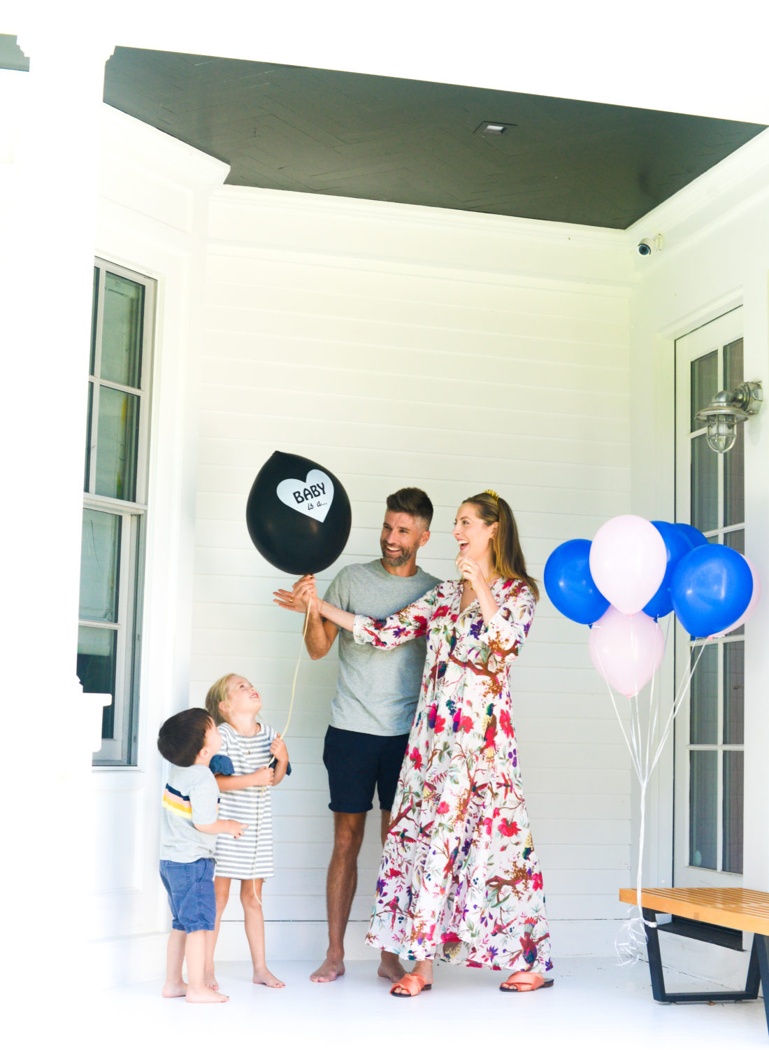 Eva Amurri Martino and husband Kyle hold a balloon with the gender of their third child
