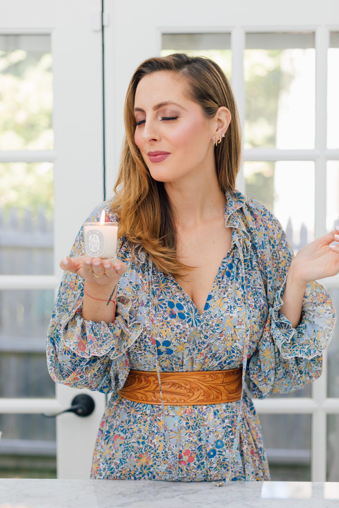 Eva Amurri Martino inhales a yummy Diptyque FIGUIER Candle in the Happily Eva After Studio