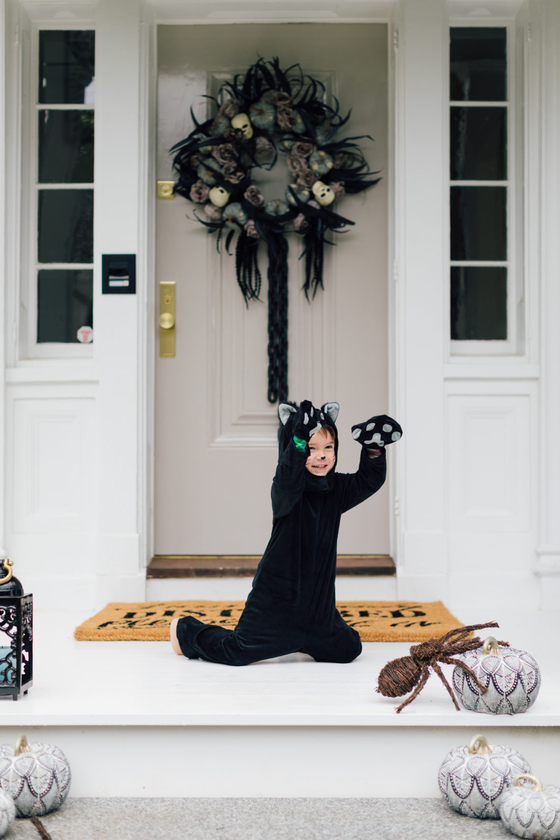 Major Martino wears a cat costume and sits on the front porch of his Connecticut home