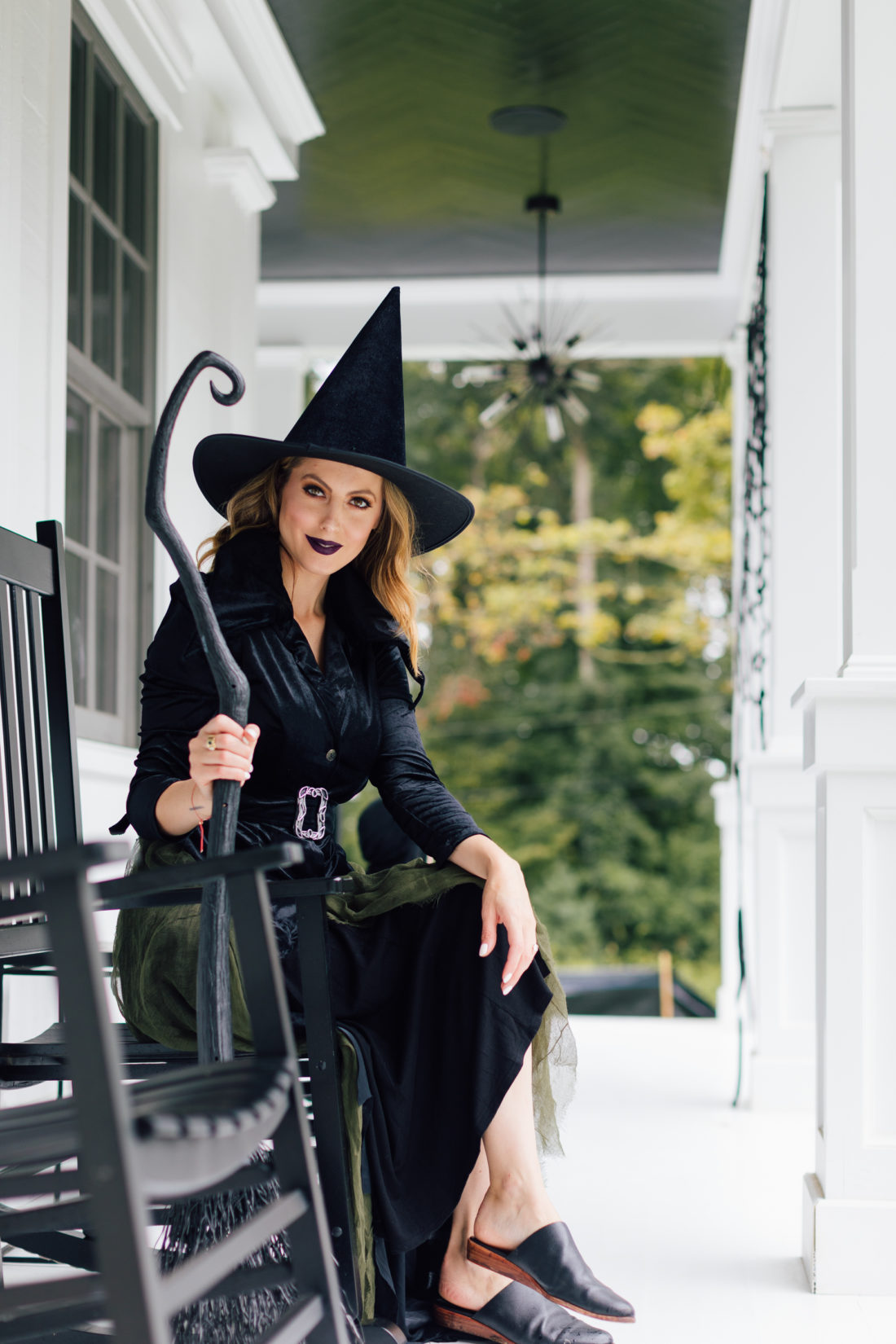 Eva Amurri Martino sits on her front porch amongst the Halloween decorations