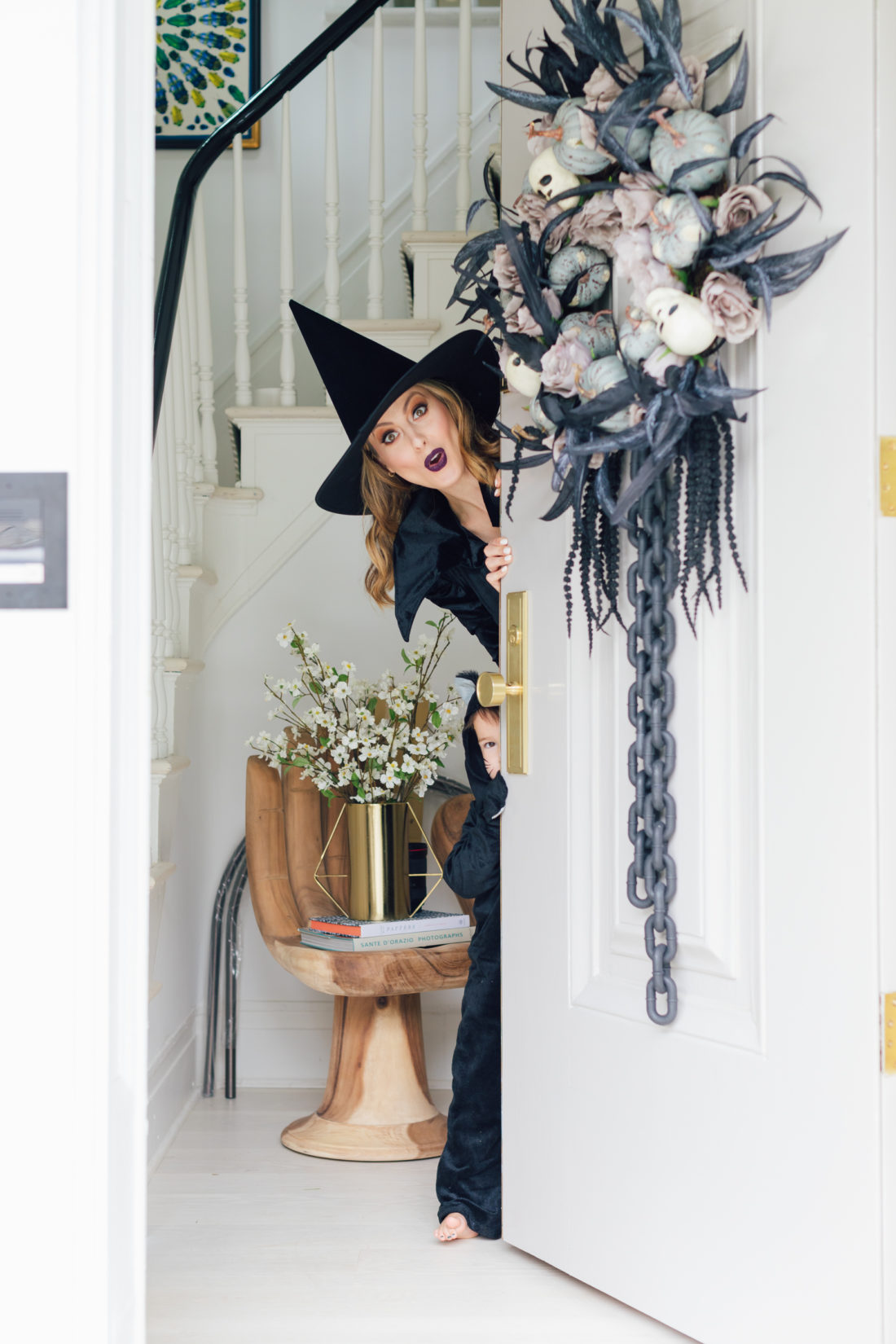 Eva Amurri Martino opens her front door to some trick or treaters