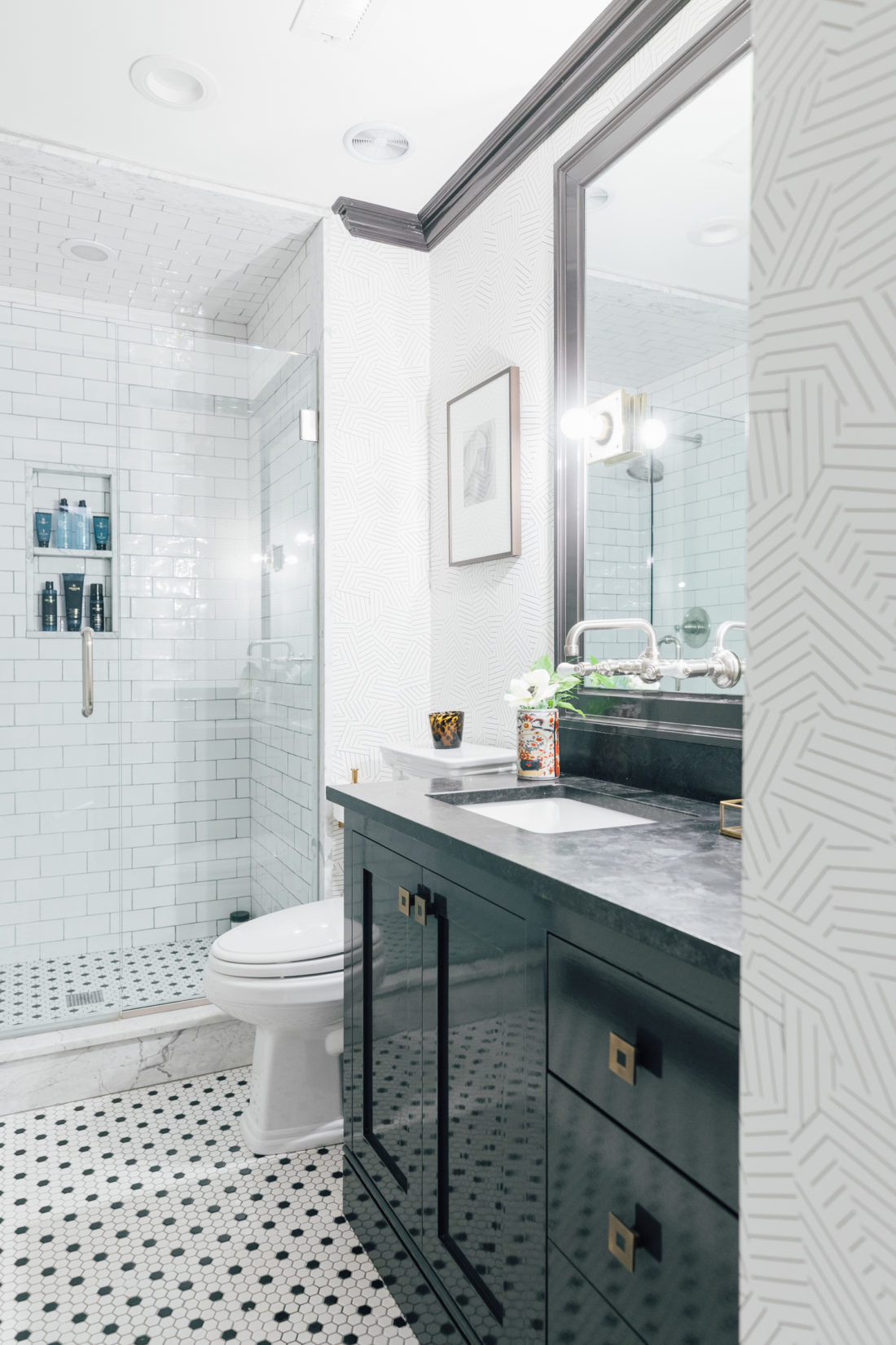 The Saint Henry Black granite countertop from Polycor inside Kyle Martino's masculine bathroom in his newly renovated Connecticut home