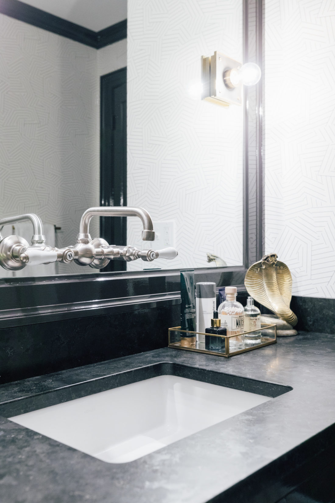 The Saint Henry Black granite countertop from Polycor inside Kyle Martino's masculine bathroom in his newly renovated Connecticut home