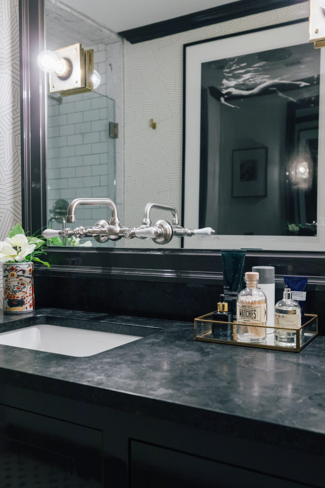 The Saint Henry Black granite countertop from Polycor inside Kyle Martino's masculine bathroom in his newly renovated Connecticut home