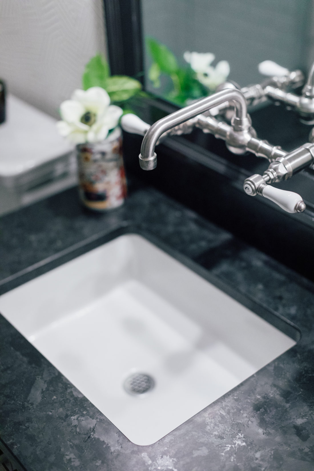 The Saint Henry Black granite countertop from Polycor inside Kyle Martino's masculine bathroom in his newly renovated Connecticut home
