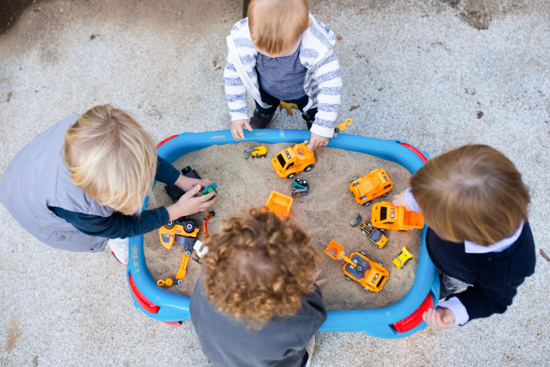 Kids playing in the sand table at Major Martino's Construction Zone themed 3rd Birthday Party