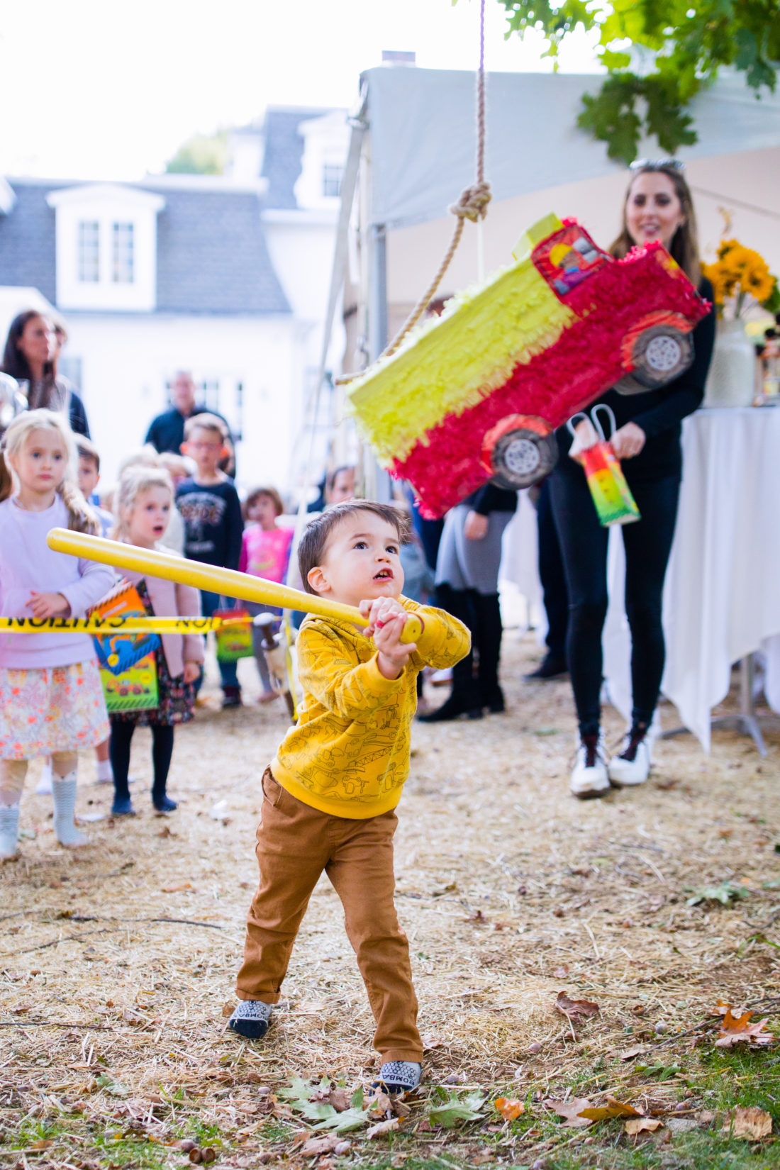 Major Martino swings at the truck shaped piñata at his Construction Zone themed birthday party