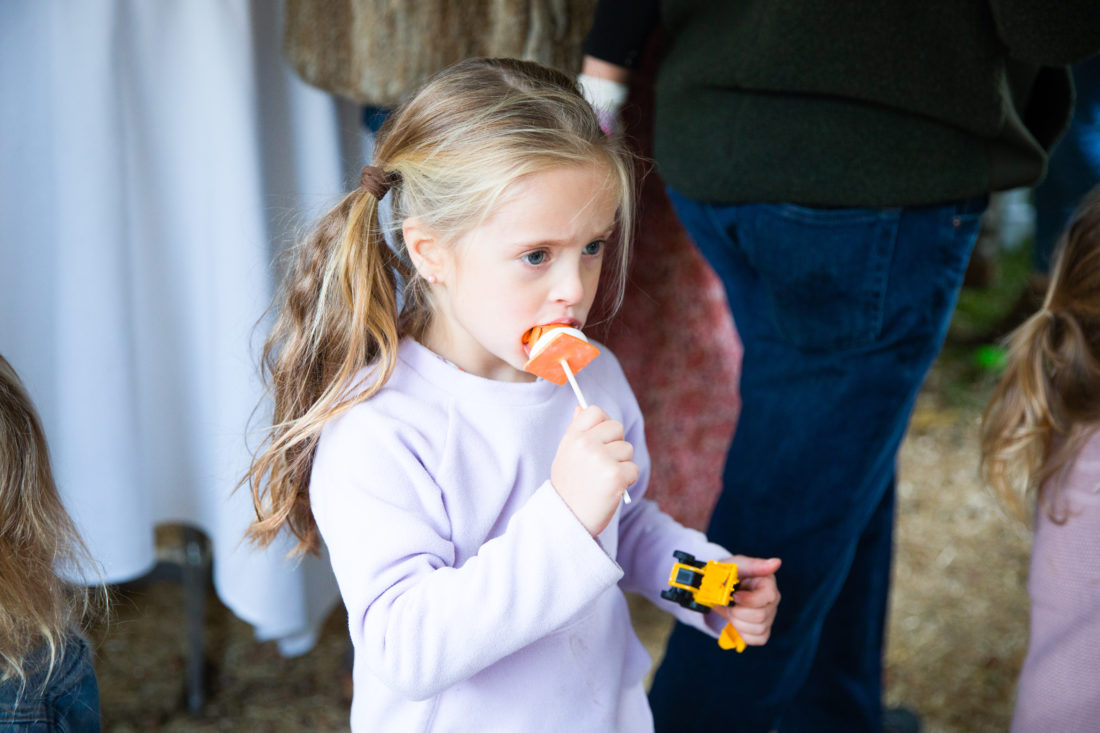 Marlowe Martino enjoys a traffic cone shaped cake pop at brother Major's Construction Zone themed birthday party