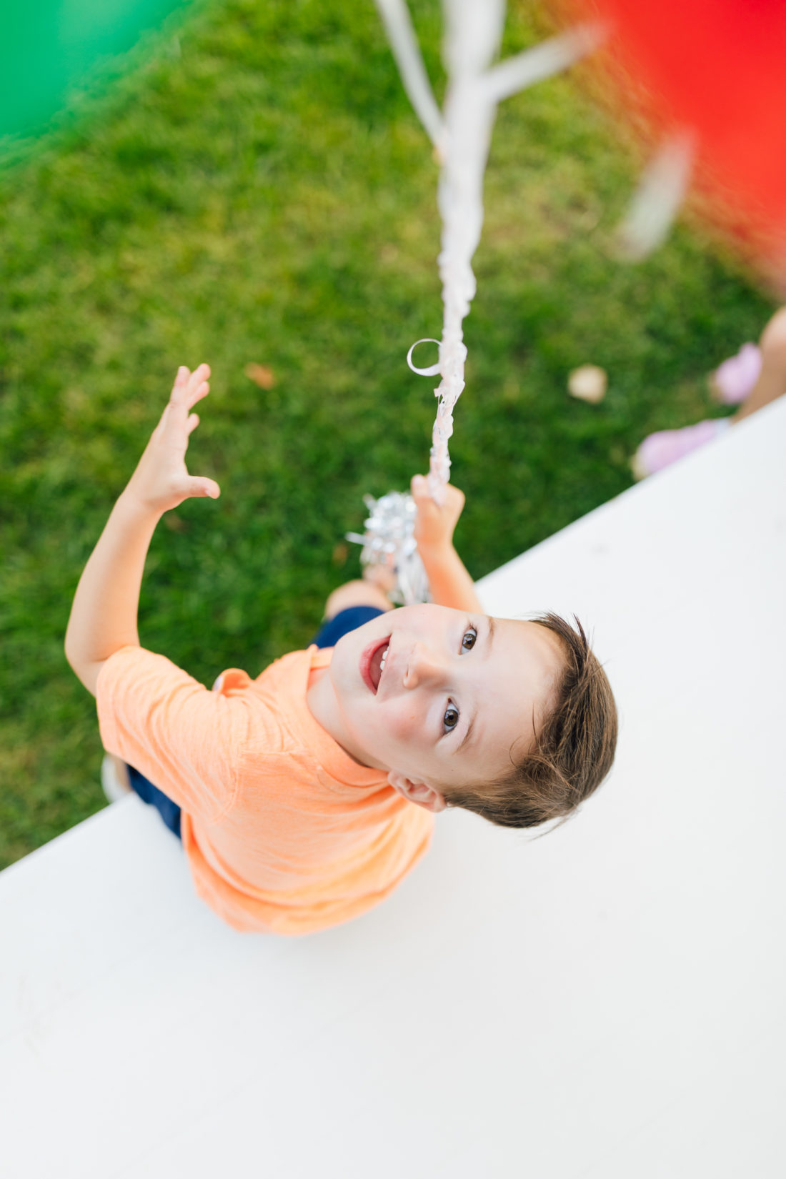 Eva Amurri Martino's son Major holds a handful of balloons for his 3rd birthday