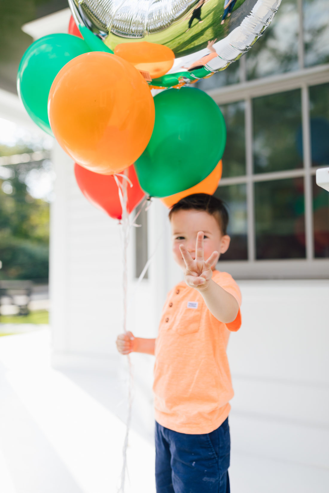 Eva Amurri Martino's son Major holds a handful of balloons for his 3rd birthday