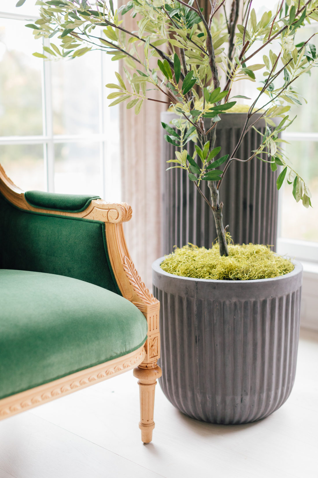 A closeup of the Taylor Burke settee and planters in Eva Amurri Martino's newly renovated Connecticut home