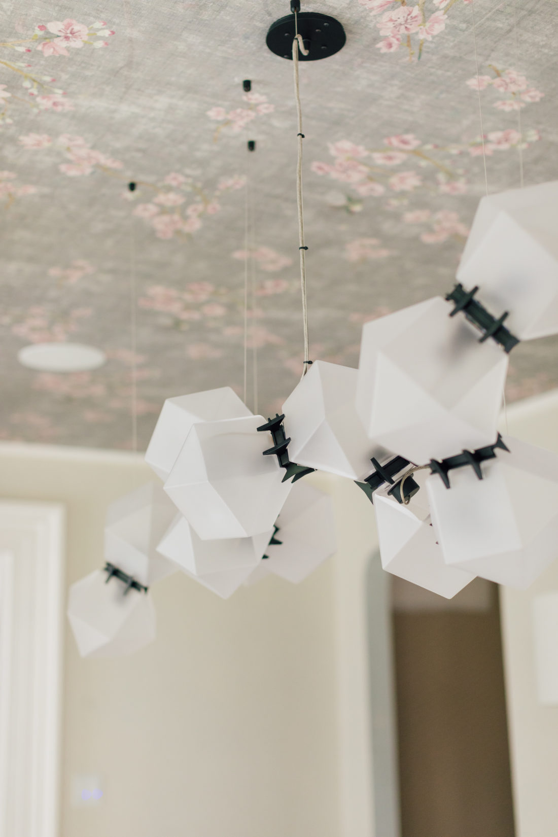 A closeup of the custom Gabriel Scott Chandelier in Eva Amurri Martino's newly renovated dining room