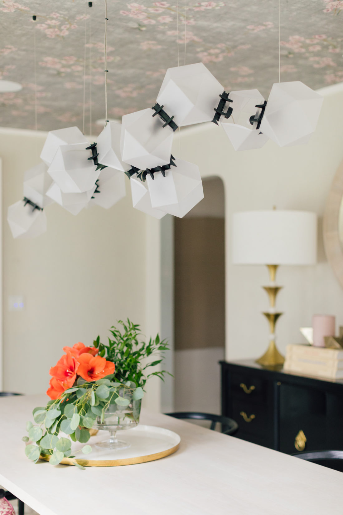 A closeup of the custom Gabriel Scott Chandelier in Eva Amurri Martino's newly renovated dining room