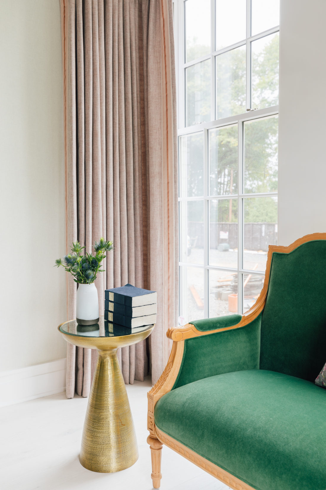 A performance velvet custom settee from Taylor Burke Home inside Eva Amurri Martino's renovated dining room