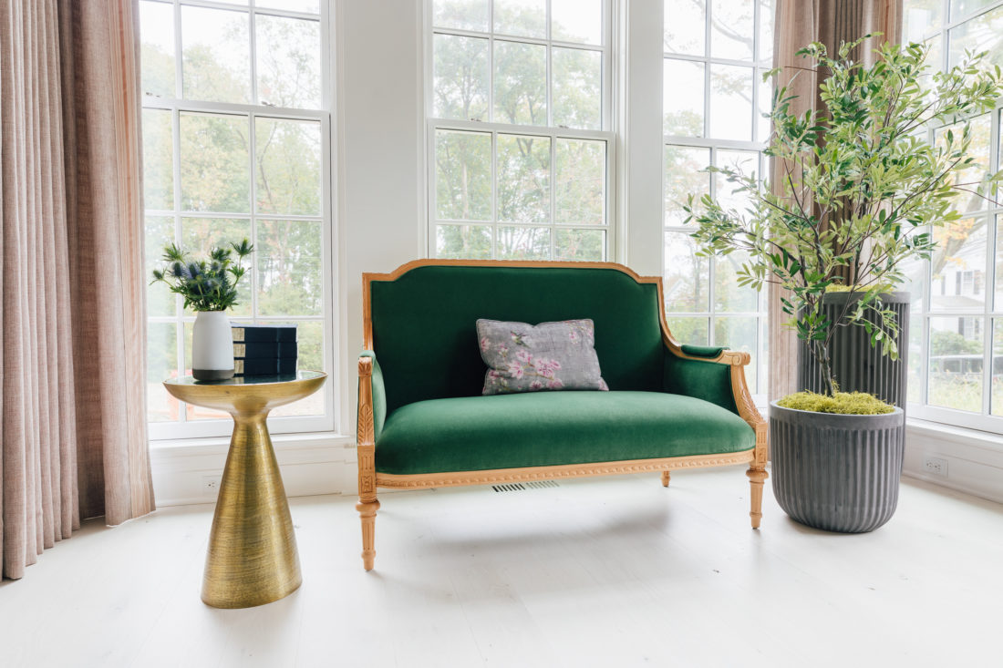 A performance velvet custom settee from Taylor Burke Home inside Eva Amurri Martino's renovated dining room