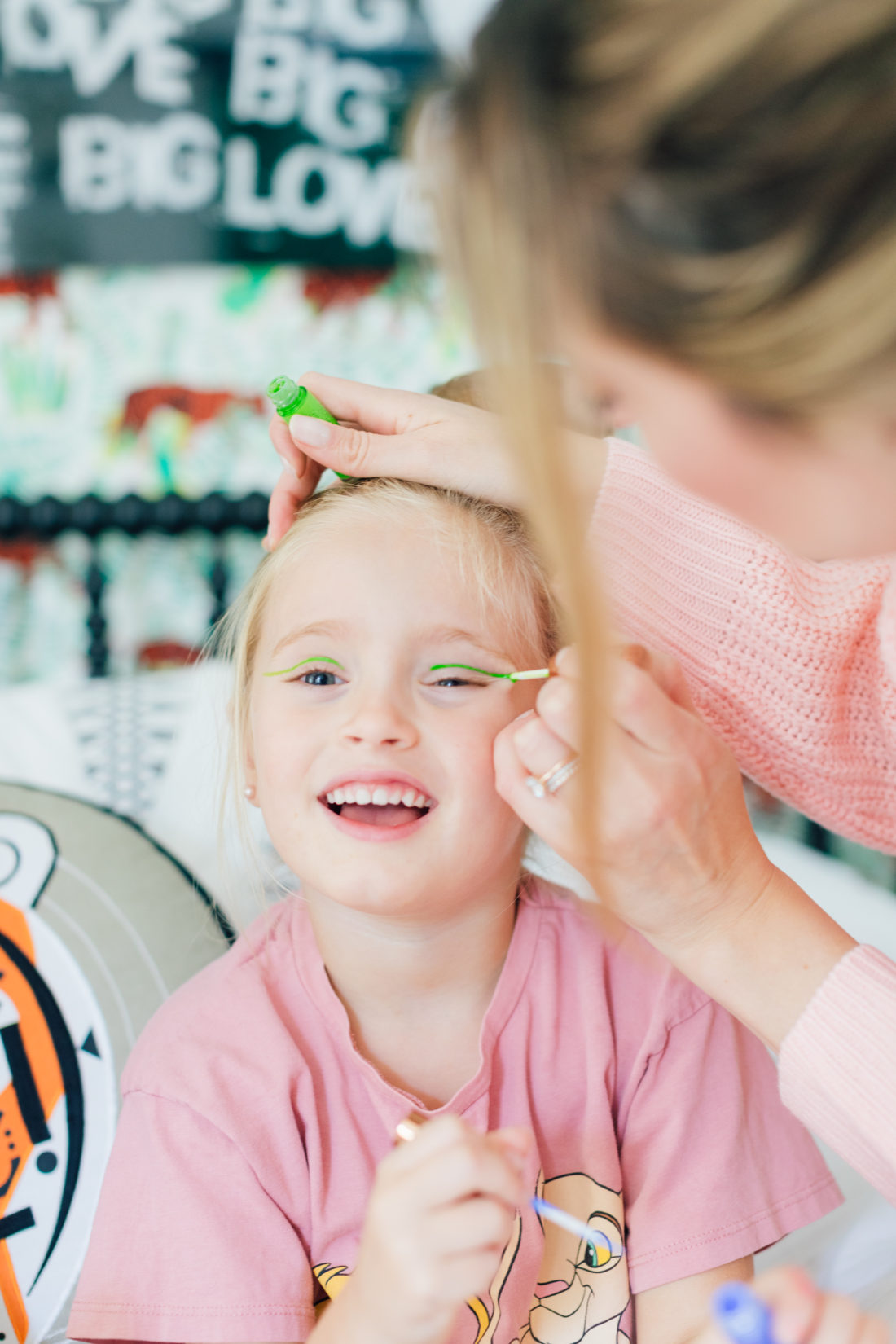 Eva Amurri Martino paints some neon eyeliner on daughter Marlowe