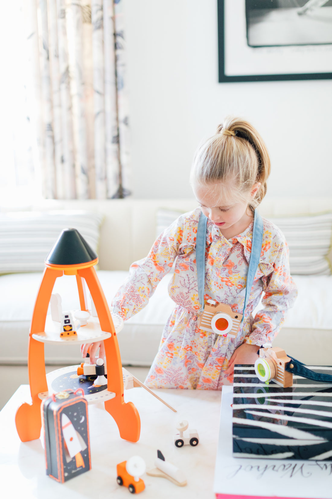 Marlowe Martino plays with a wooden toy from Verishop