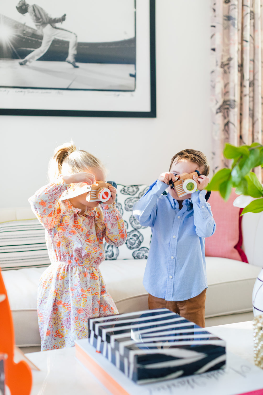 Marlowe and Major Martino play with a wooden toy from Verishop