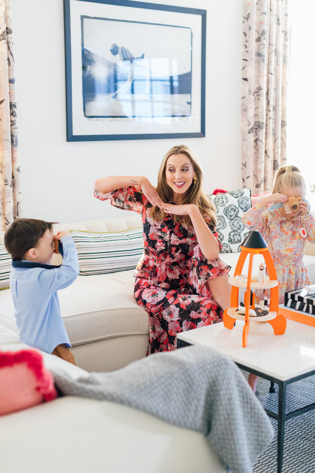 Marlowe and Major Martino play with a wooden toy from Verishop