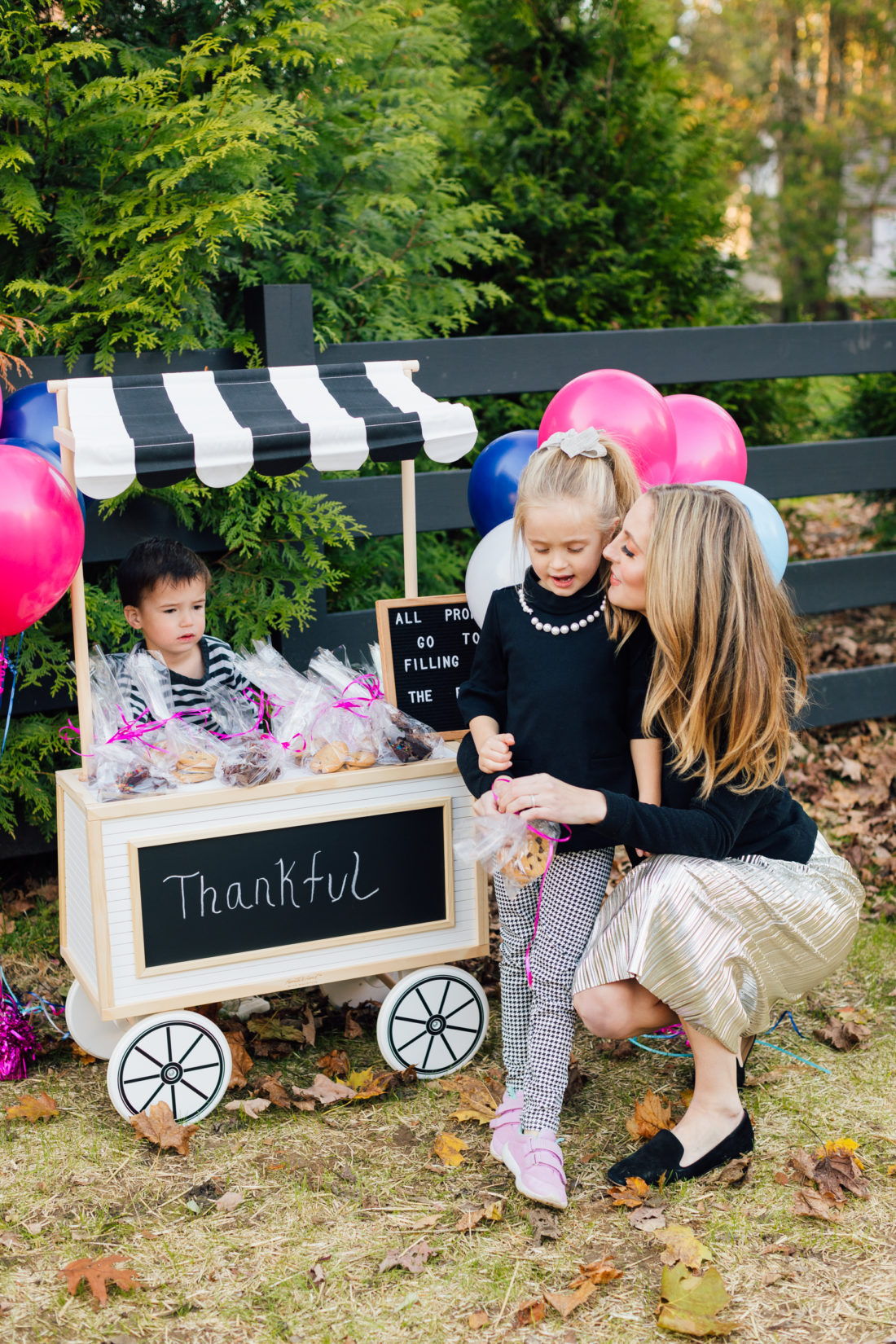 Eva Amurri Martino hugs daughter Marlowe at their bake sale benefitting nonprofit organization Filling in the Blanks