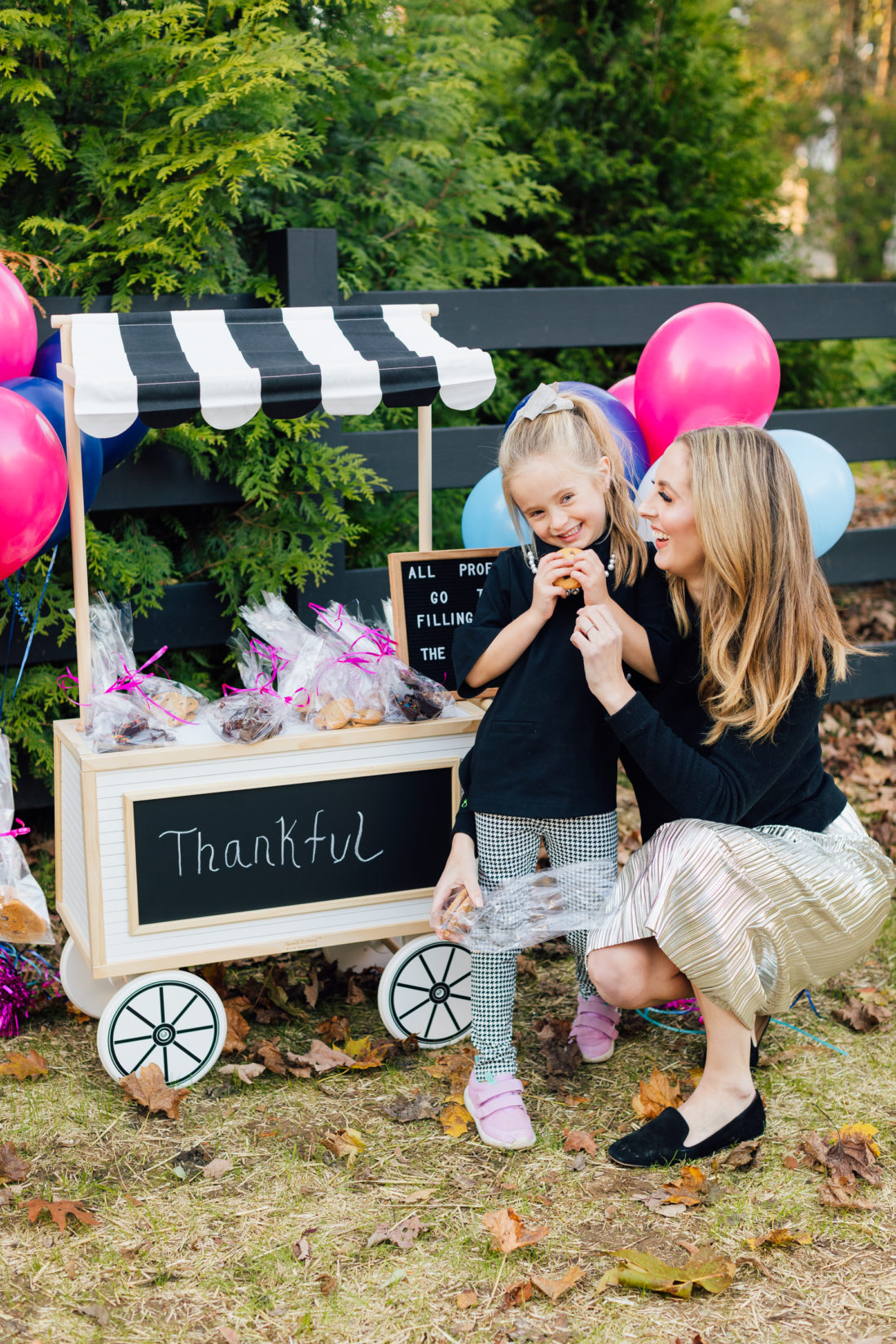 Eva Amurri Martino hugs daughter Marlowe at their bake sale benefitting nonprofit organization Filling in the Blanks