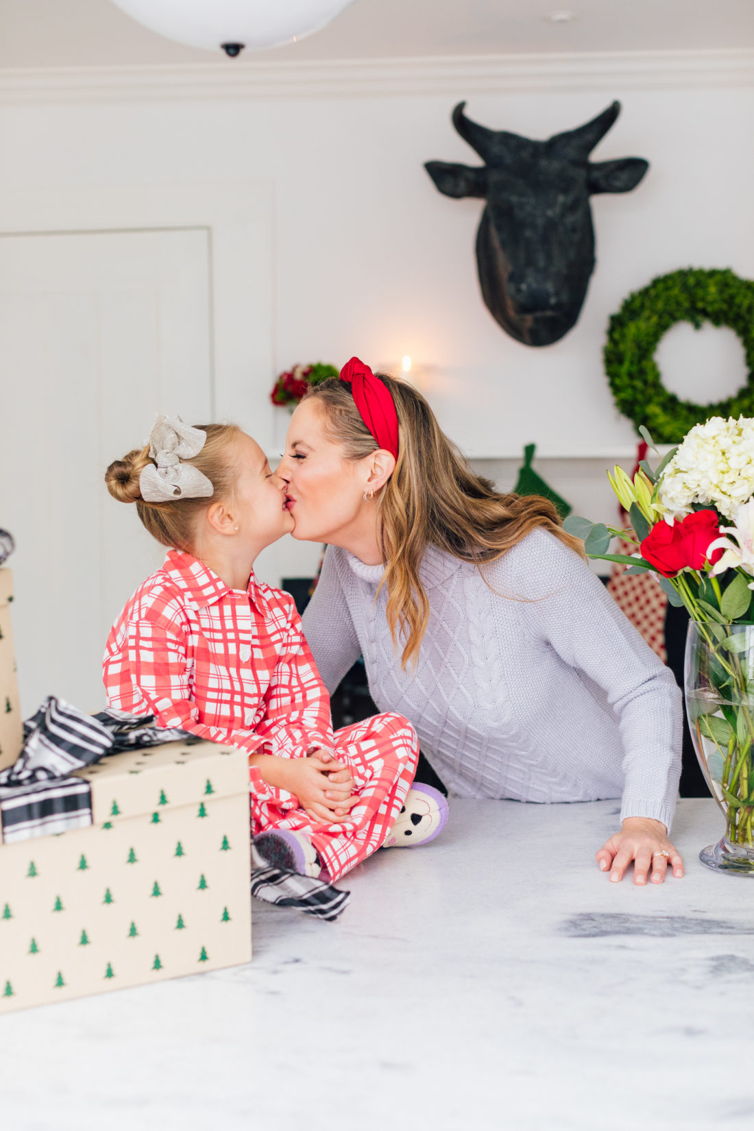 Eva Amurri Martino kisses daughter Marlowe while they wrap Christmas presents