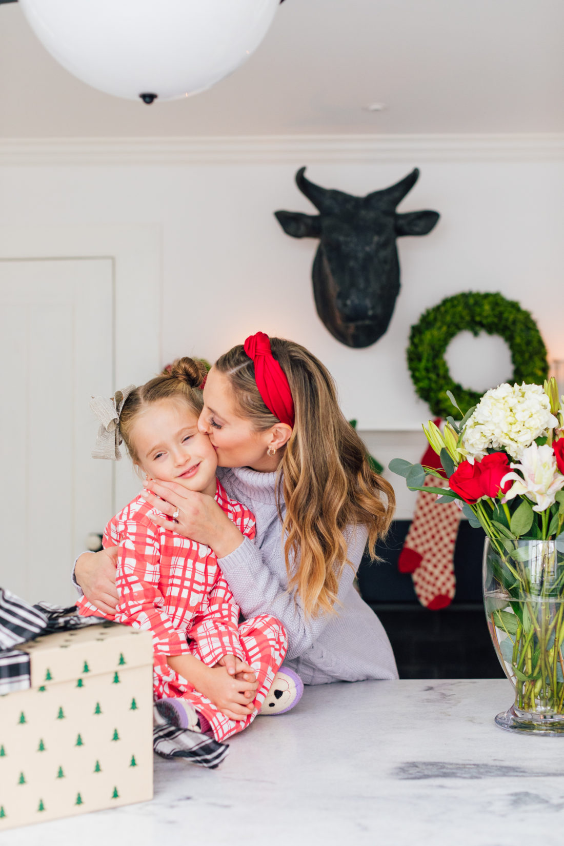 Eva Amurri Martino kisses daughter Marlowe while they wrap Christmas presents