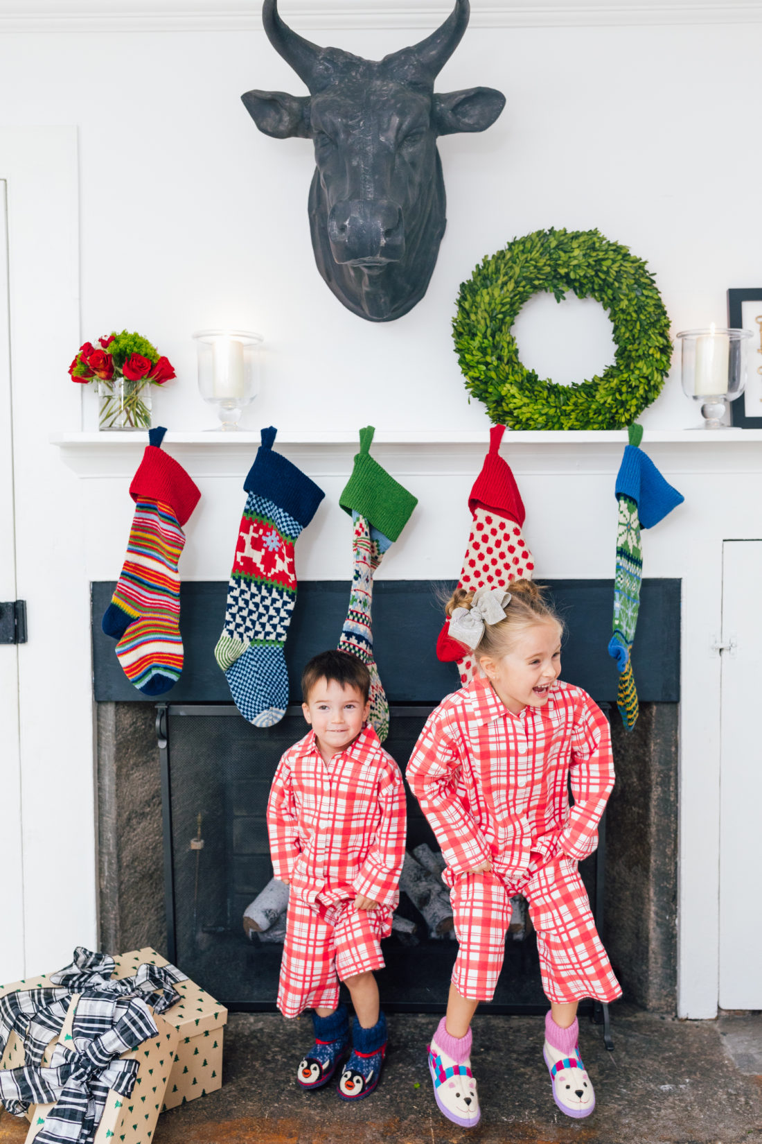 Marlowe and Major Martino show off their matching pajamas in front of their Christmas stockings, all from Garnet Hill