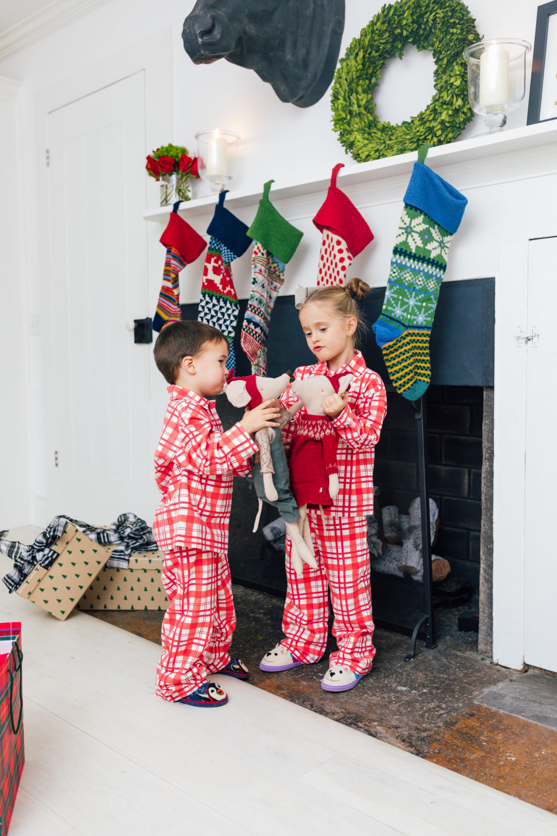 Marlowe and Major Martino show off their matching pajamas in front of their Christmas stockings, all from Garnet Hill