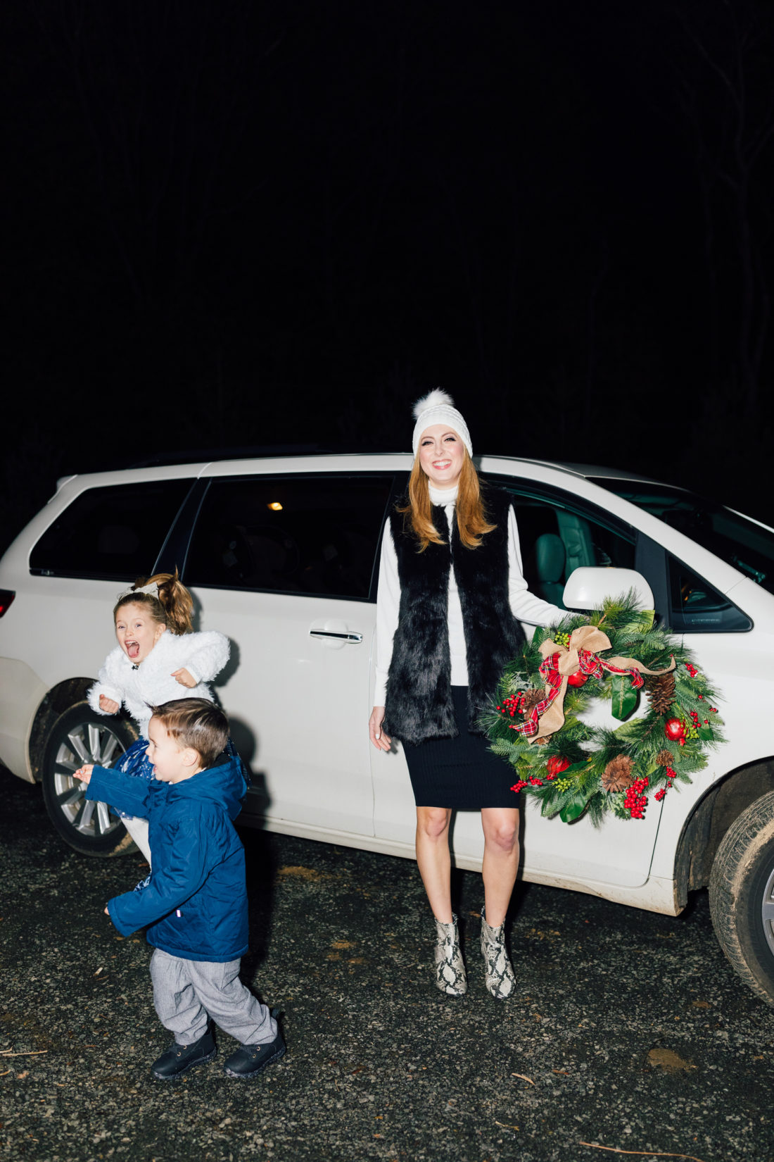 Eva Amurri and kids Marlowe and Major get ready to hang their Christmas Wreath from Walmart