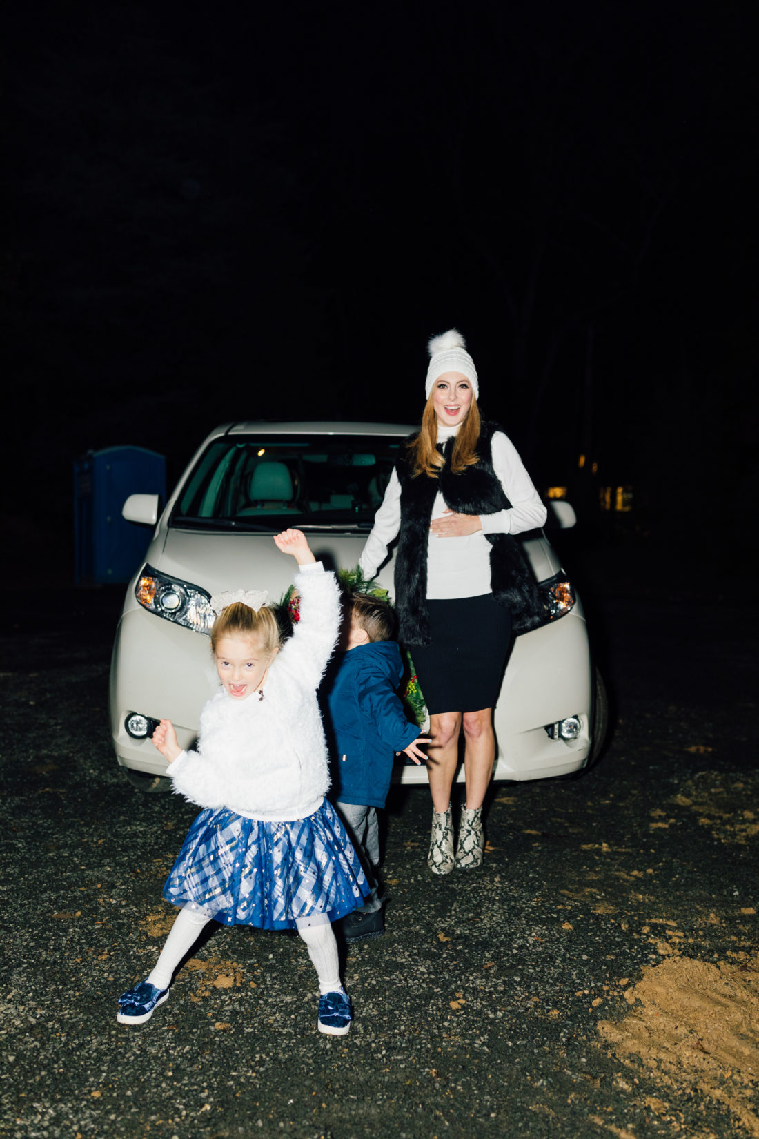 Eva Amurri and kids Marlowe and Major get ready to hang their Christmas Wreath from Walmart