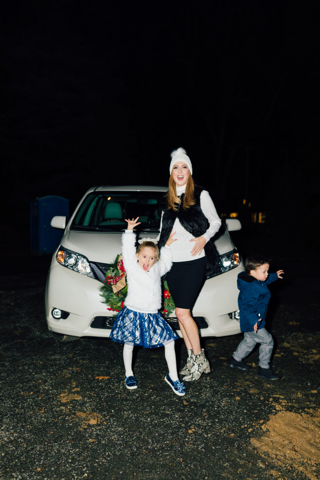 Eva Amurri and kids Marlowe and Major get ready to hang their Christmas Wreath from Walmart