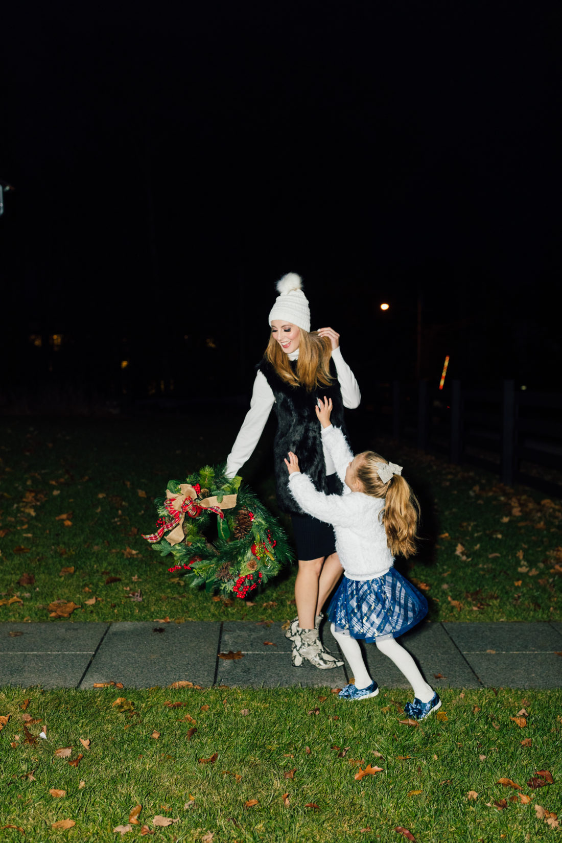 Eva Amurri and kids Marlowe and Major get ready to hang their Christmas Wreath from Walmart