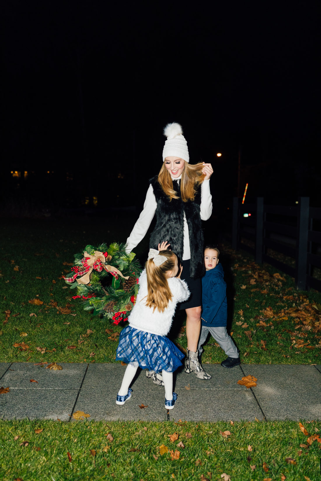 Eva Amurri and kids Marlowe and Major get ready to hang their Christmas Wreath from Walmart