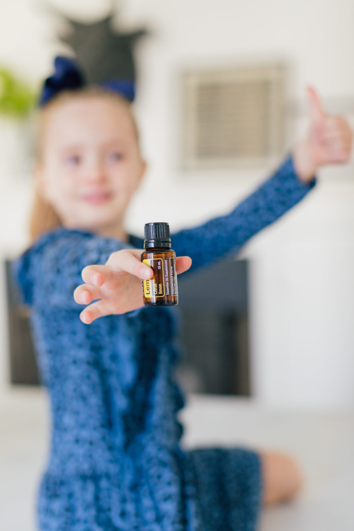 Marlowe Martino holds up essential oils