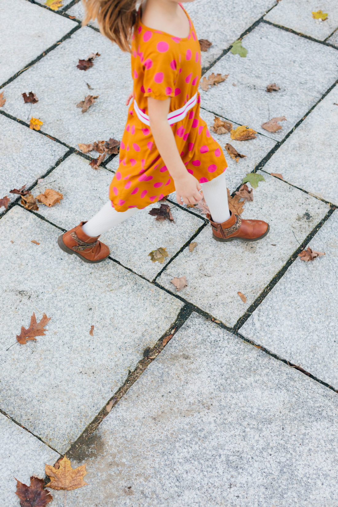 Marlowe Martino runs to an outdoor movie night on the back patio of her Connecticut home