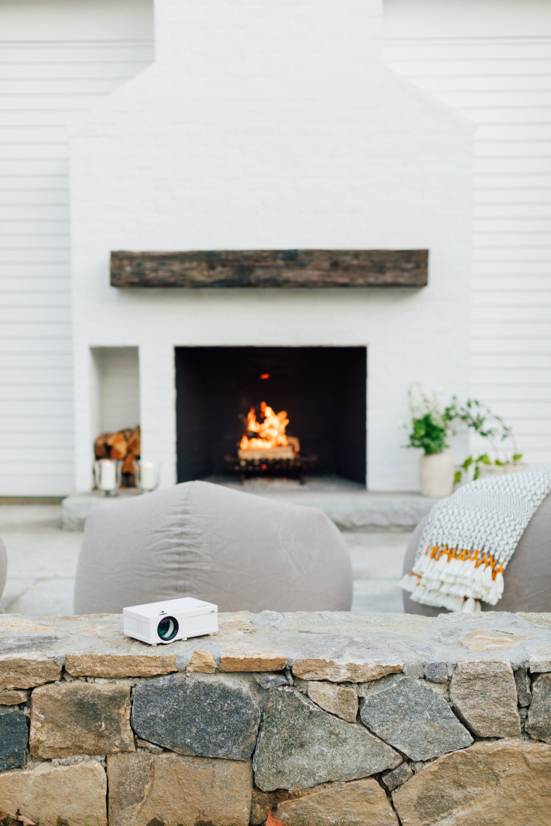 A portable projector for an outdoor movie night sits on the back patio at Eva Amurri's home in Connecticut